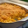 Bowl of creamy Smoky Mac and Cheese topped with breadcrumbs.